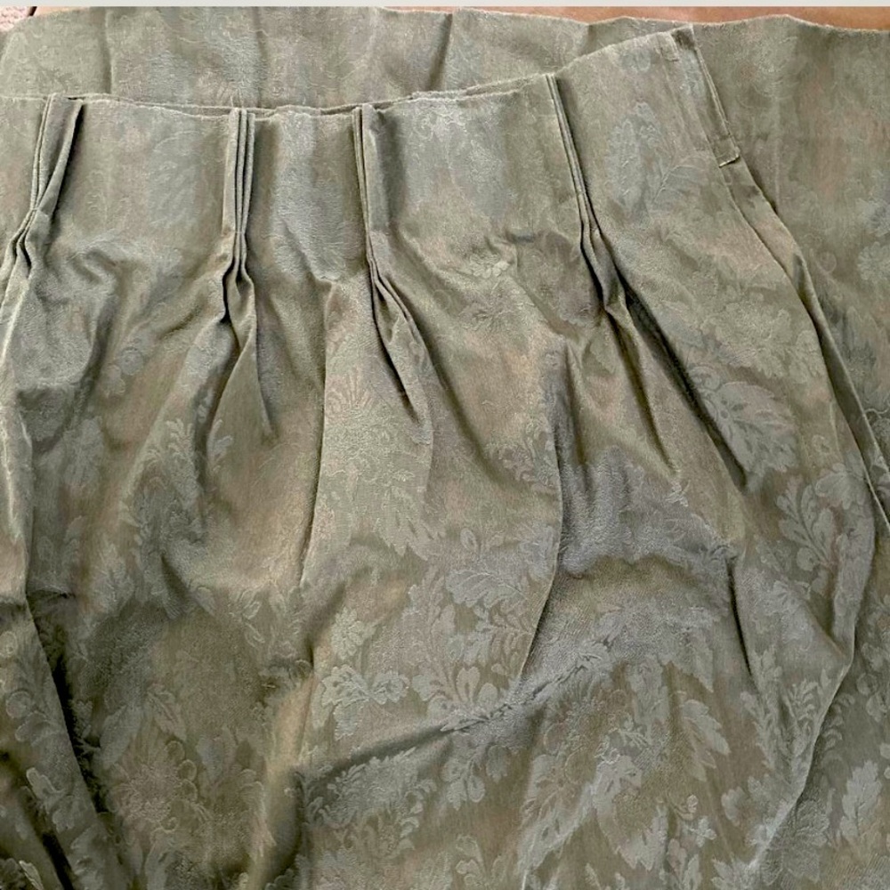 Pinch pleated insulated JCP Home collection curtains.